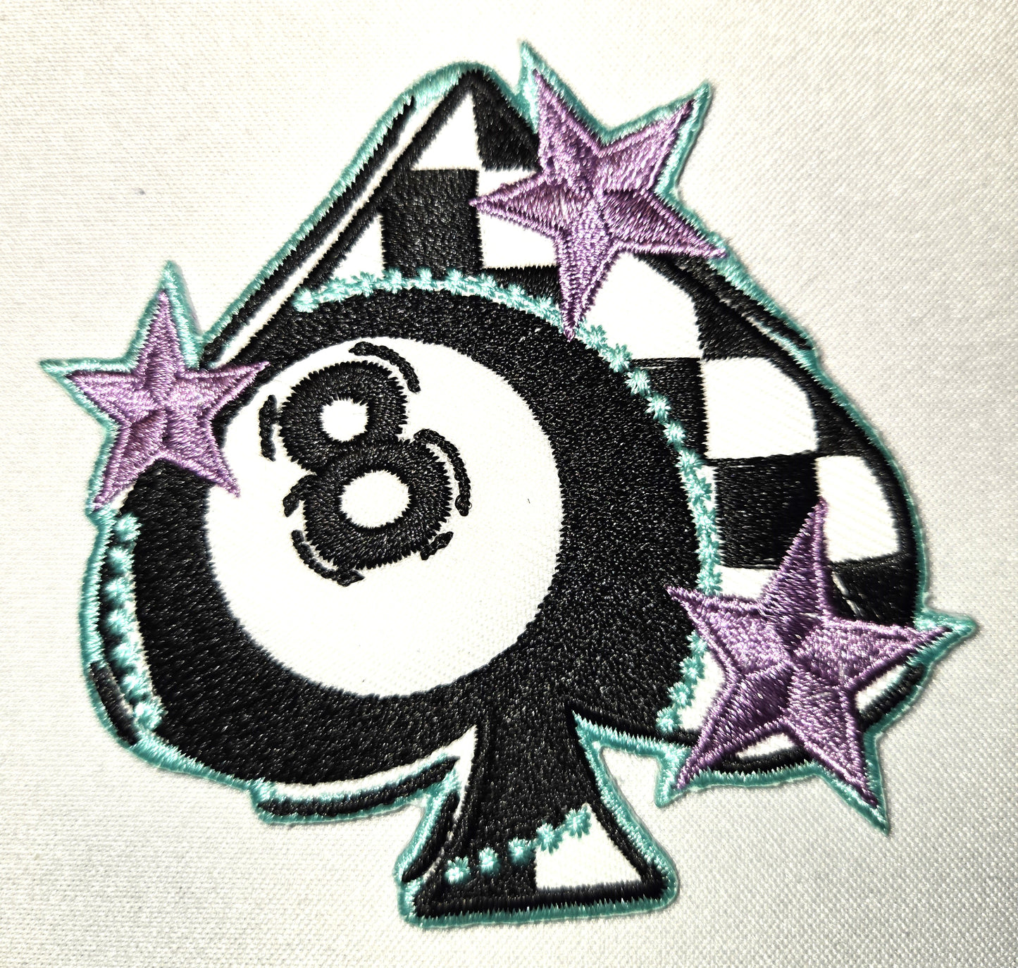 Checkered spade with 8 ball